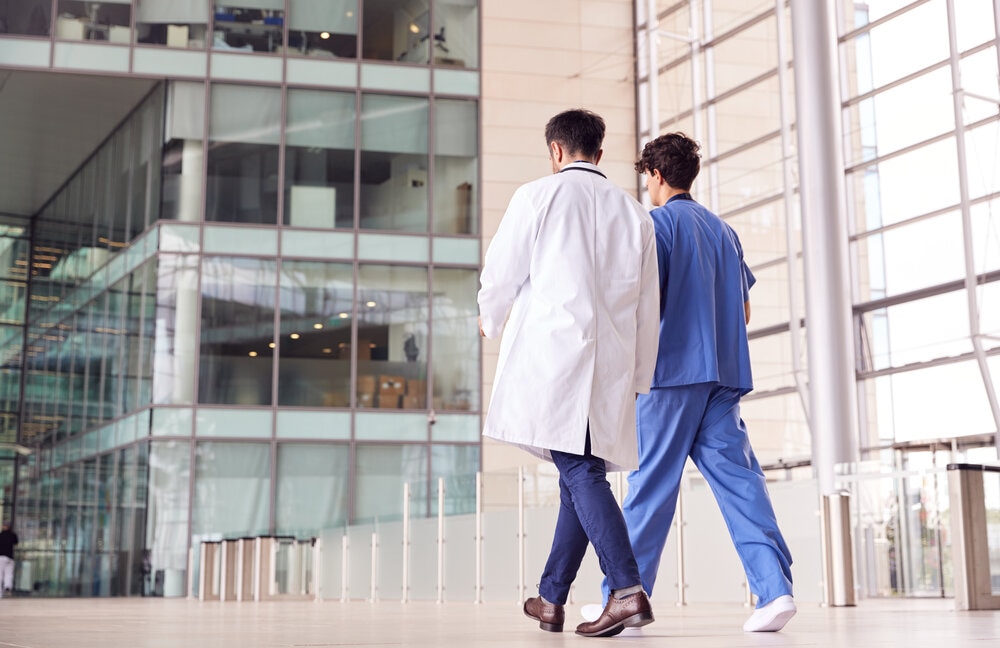 two doctors walking into a hospital