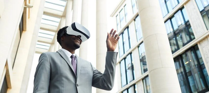 Businessman wearing VR goggles in the office