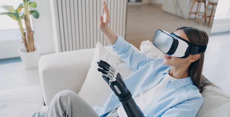 Business woman wearing VR headset at home